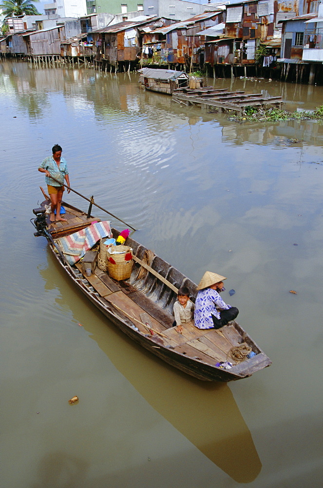 Boat on the Kinh Ben Nghe, a tributary of the Saigon River, in downtown Ho Chi Minh City (formerly Saigon), Vietnam, Indochina, Southeast Asia, Asia