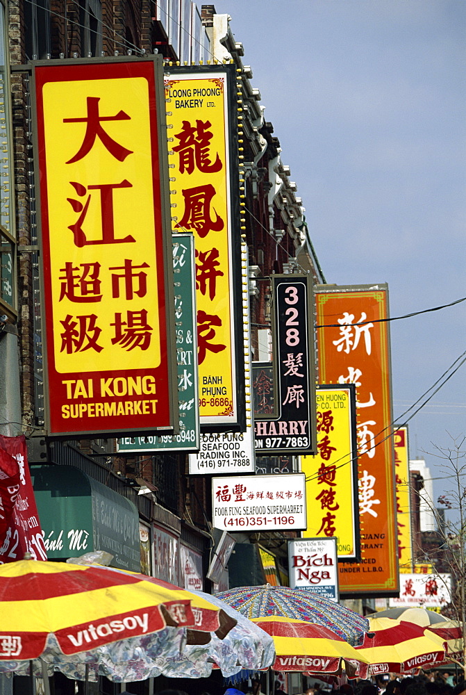 Bi-lingual Chinese and English signs on Spadina Avenue in Chinatown in downtown Toronto, Ontario, Canada, North America