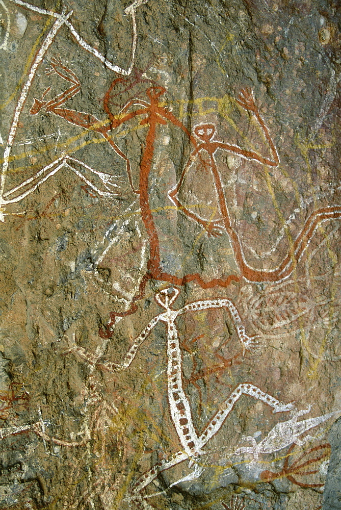 Painting of dancing figures at Nourlangie Rock, sacred aboriginal shelter and rock art site in the north east of Kakadu National Park, UNESCO World Heritage Site, Northern Territory, Australia, Pacific