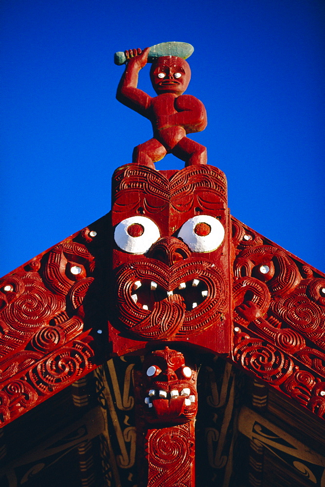 Carved portal of a church in a Maori village at the Whakarewarewa thermal and cultural area in Rotorua, North Island, New Zealand 