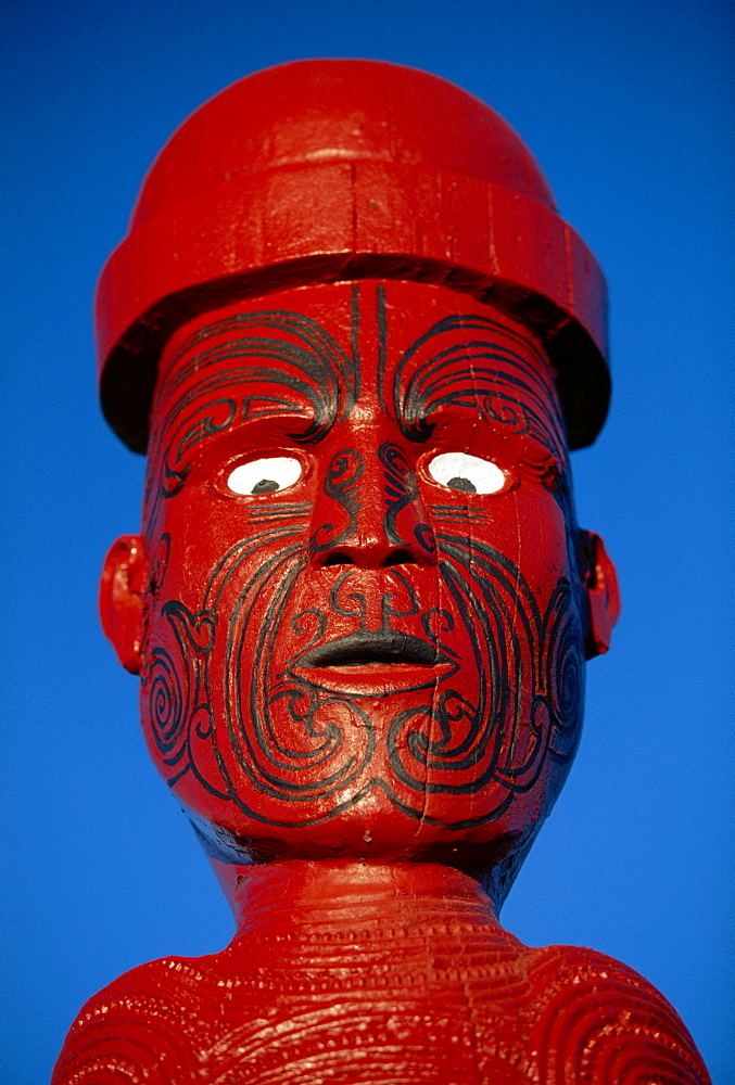 Traditional Maori 'Poupou' figure, Whakarewarewa village, Rotorua, New Zealand 