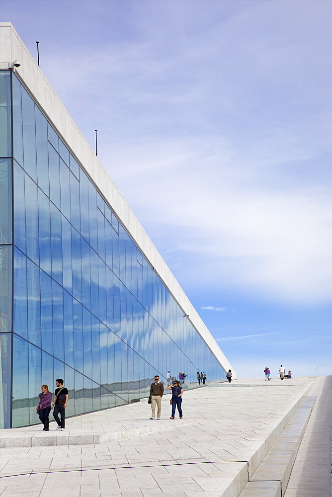 Visitors walking outside the Oslo Opera house exterior in summer sunshine, city centre, Oslo, Norway, Scandinavia, Europe