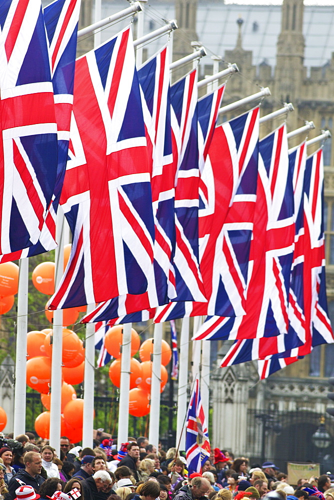 Union flags and spectators outside Houses of Parliament, during the marriage of Prince William to Kate Middleton, 29th April 2011, London, England, United Kingdom, Europe