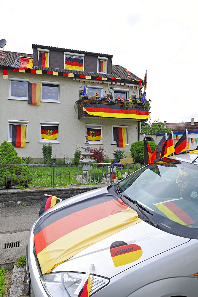 House and car decorated with German flags during Football World Cup 2010, Stuttgart, Baden-Wuerttemberg, Germany, Europe