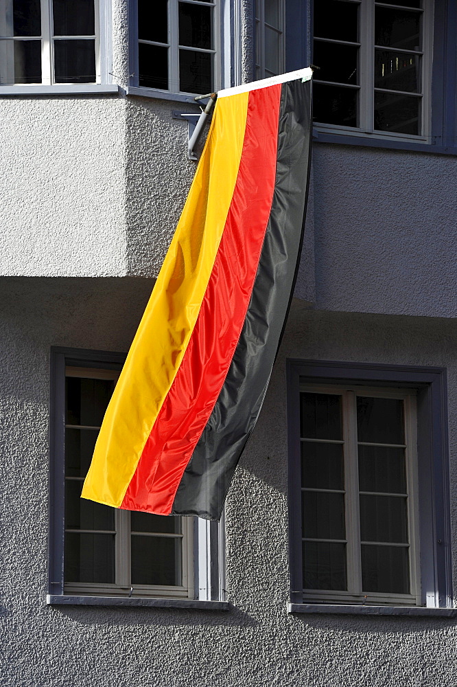 German flag hanging out of the window of a house during the 2010 FIFA World Cup