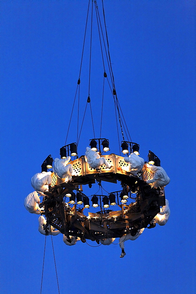 White-clad trapeze artists hanging upside down from a platform in the air, Global Rheingold, open-air theater by La Fura dels Baus, Duisburg-Ruhrort, Ruhrgebiet area, North Rhine-Westphalia, Germany, Europe