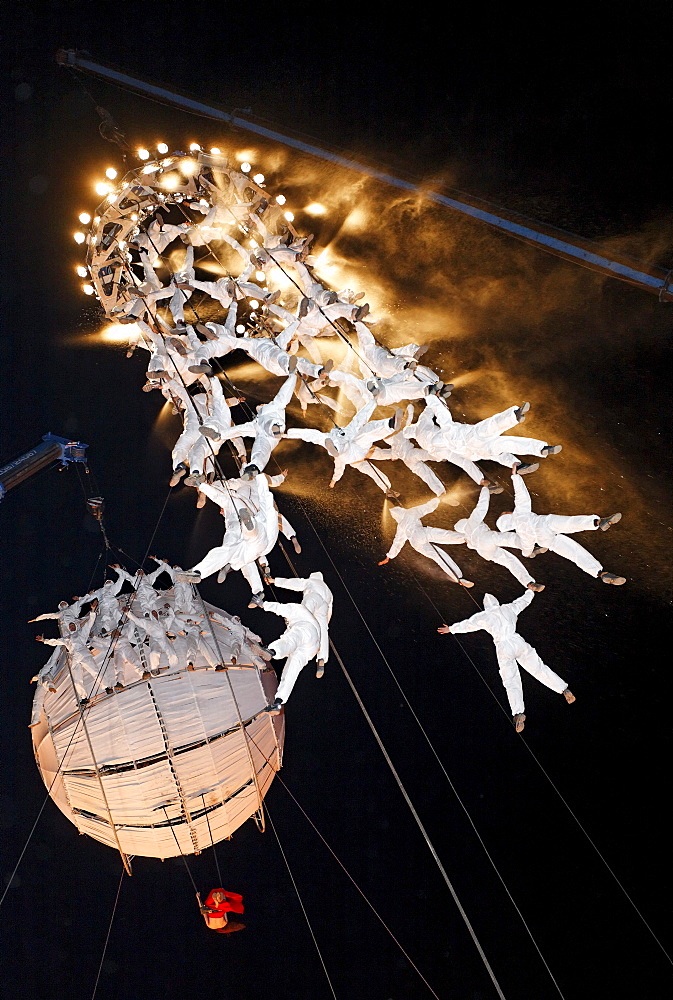 White-clad trapeze artists and globe floating in the sky, Global Rheingold, open-air theater by La Fura dels Baus, Duisburg-Ruhrort, Ruhrgebiet area, North Rhine-Westphalia, Germany, Europe