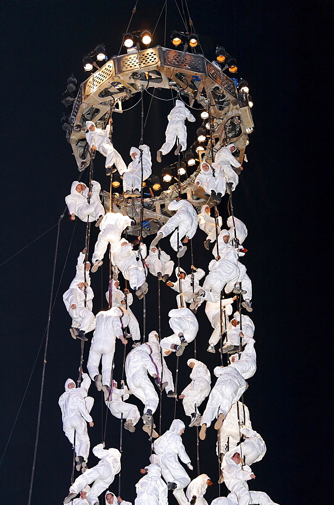 White-clad trapeze artists hanging from ropes, Global Rheingold, open-air theater by La Fura dels Baus, Duisburg-Ruhrort, Ruhrgebiet area, North Rhine-Westphalia, Germany, Europe