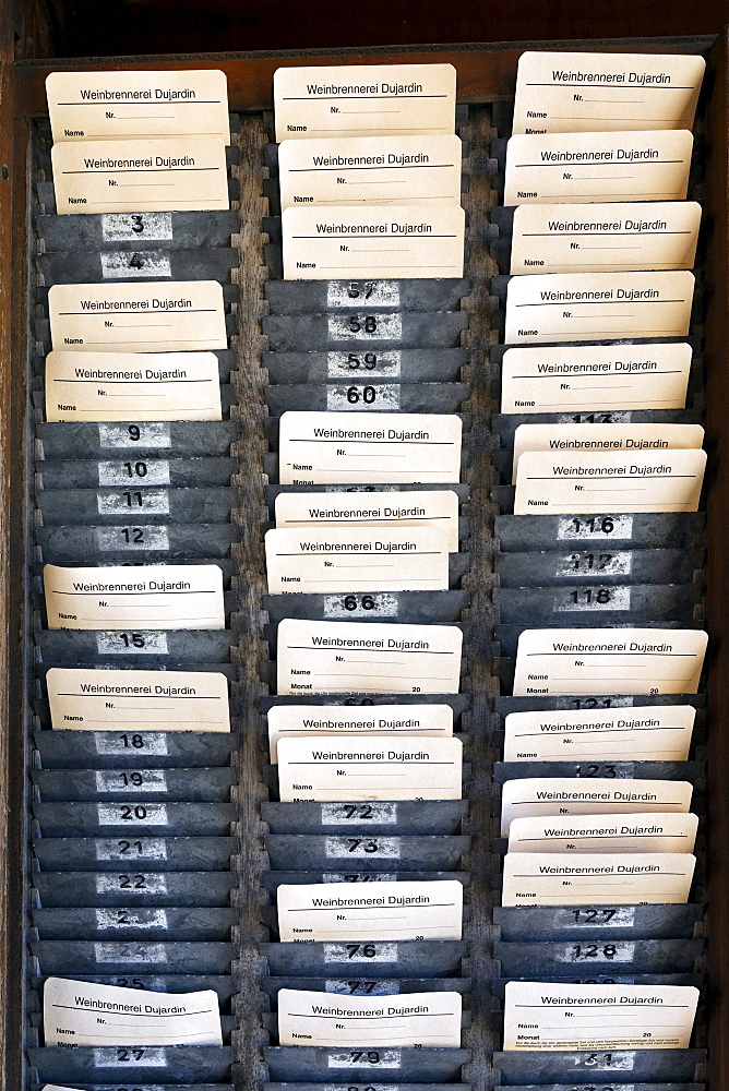 Board with time-stamped cards, time-punch machine, former Dujardin distillery, Krefeld-Uerdingen, North Rhine-Westphalia, Germany, Europe