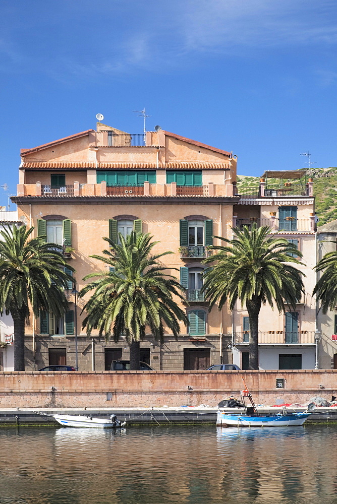 Fishing boats on the Temo River in front of a Palazzi, Bosa, Oristano Province, Sardinia, Italy, Europe