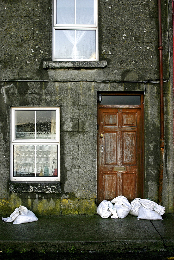 Sand bags, house front, City of Galway, Republic of Ireland, Europe