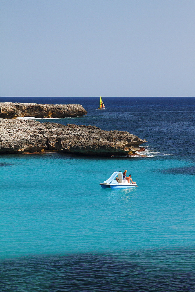 Sea with boats on the coast between Son Xoriguer and Cala en Bosc, Menorca, Minorca, Spain, Europe