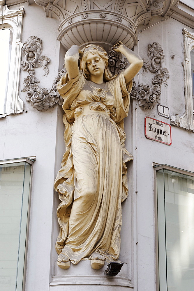 Atlas statue and stucco on the facade of a house, Gruenderzeit style, Tuchlauben shopping street, 1st district, Vienna, Austria, Europe