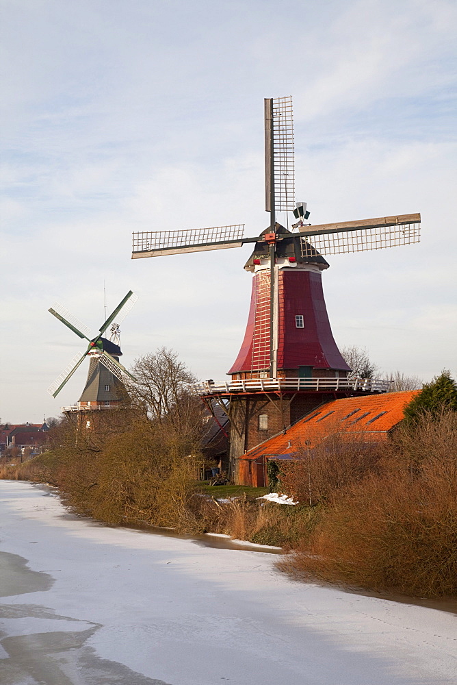 Twin Dutch windmills, Greetsiel, Krummhoern, East Frisia, Lower Saxony, North Sea, Germany, Europe