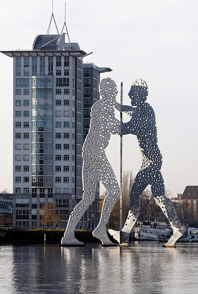 Molecule Man, monumental metal sculpture in the Spree river, Treptowers Allianz administration, Treptow district, Berlin, Germany, Europe