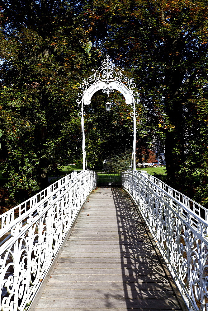 Ornate bridge over the river Oos to the Hotel Bellevue with park on the river Oos, Lichtentaler Allee, Baden-Baden, Baden-Wuerttemberg, Germany, Europe