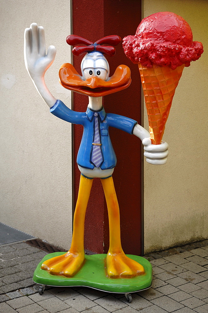 Large comic figure holding an ice-cream cone in front of an ice cream parlor, Heroldsberg, Middle Franconia, Bavaria, Germany, Europe