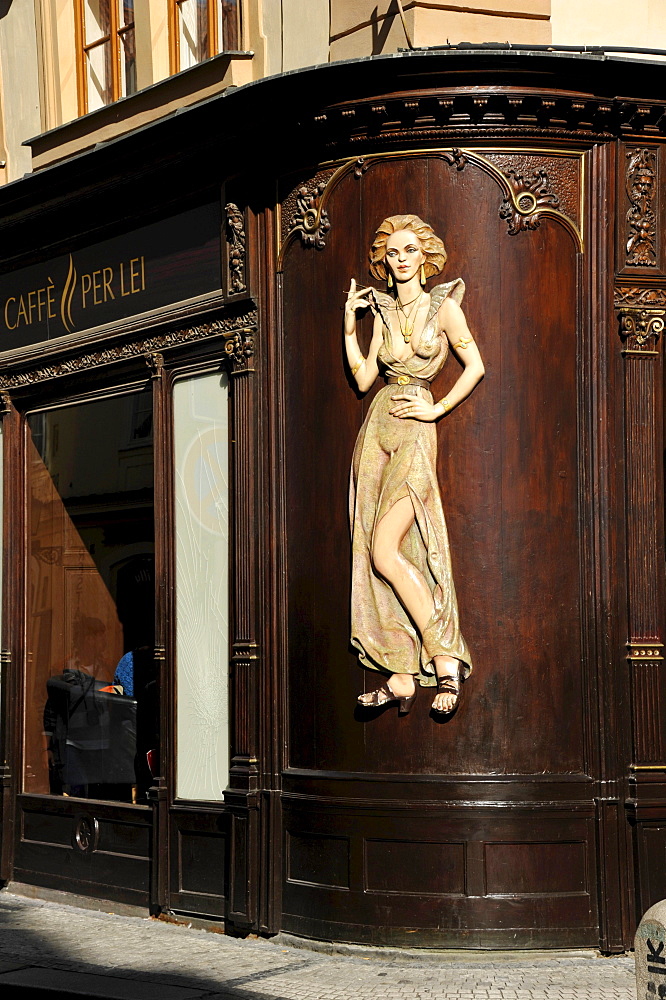 Art Nouveau house emblem of a lascivious woman, wood relief on the facade of the Caffe per Lei Cafe, historic district, Prague, Bohemia, Czech Republic, Europe