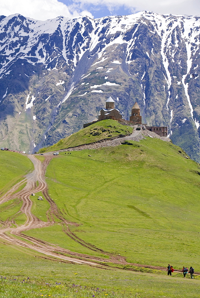 The famous Gergeti Trinity Church or Tsminda Sameba at the Chechen border, Stepantsminda, Georgia, Caucasus, Middle East