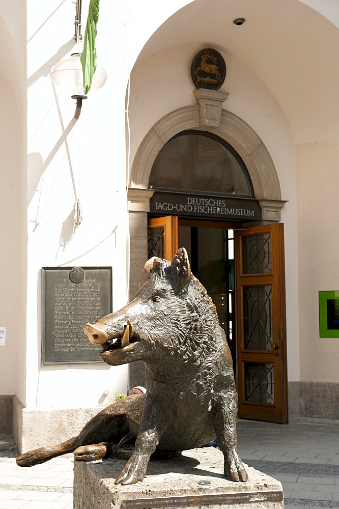 German Hunting and Fishing Museum in the former Augustinian church, sitting tusker at the entrance Keiler, Munich, Upper Bavaria, Bavaria, Germany, Europe