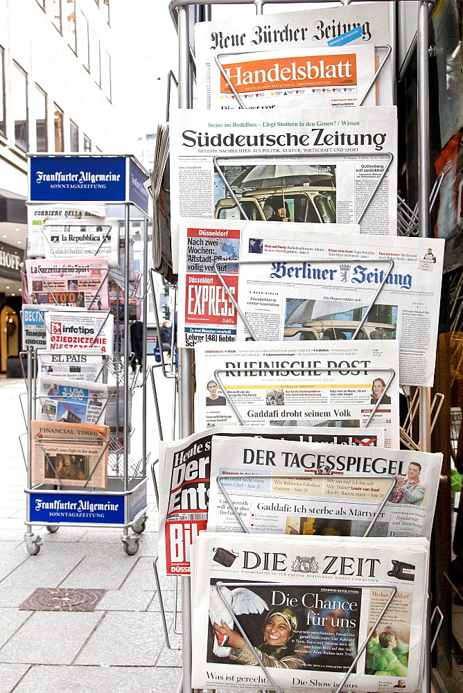 Newspaper rack with German and Swiss newspapers at a newspaper kiosk, Koenigsallee shopping promenade, short Koe, Duesseldorf, North Rhine-Westphalia, Germany, Europe