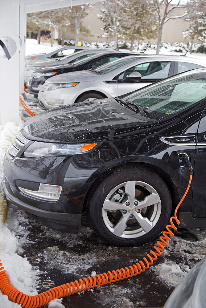 Chevrolet Volt electric cars charging outside the General Motors Detroit-Hamtramck Assembly Plant, where the Volt is manufactured, Detroit, Michigan, USA