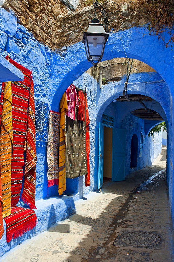 Carpets of a carpet sell in an alley in the old town or Medina, Chefchaouen, Morocco, Africa