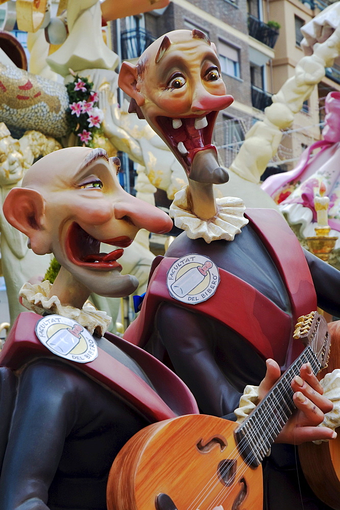 Gap-toothed musicians wearing uniforms, sculptures of the Faculty of Drinkers at a parade, Fallas festival, Falles festival in Valencia in early spring, Spain, Europe