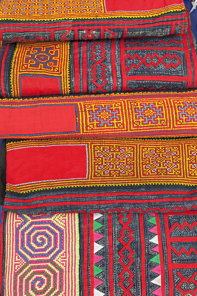 Colourful textiles on sale at the night market in Luang Prabang, Laos, Southeast Asia