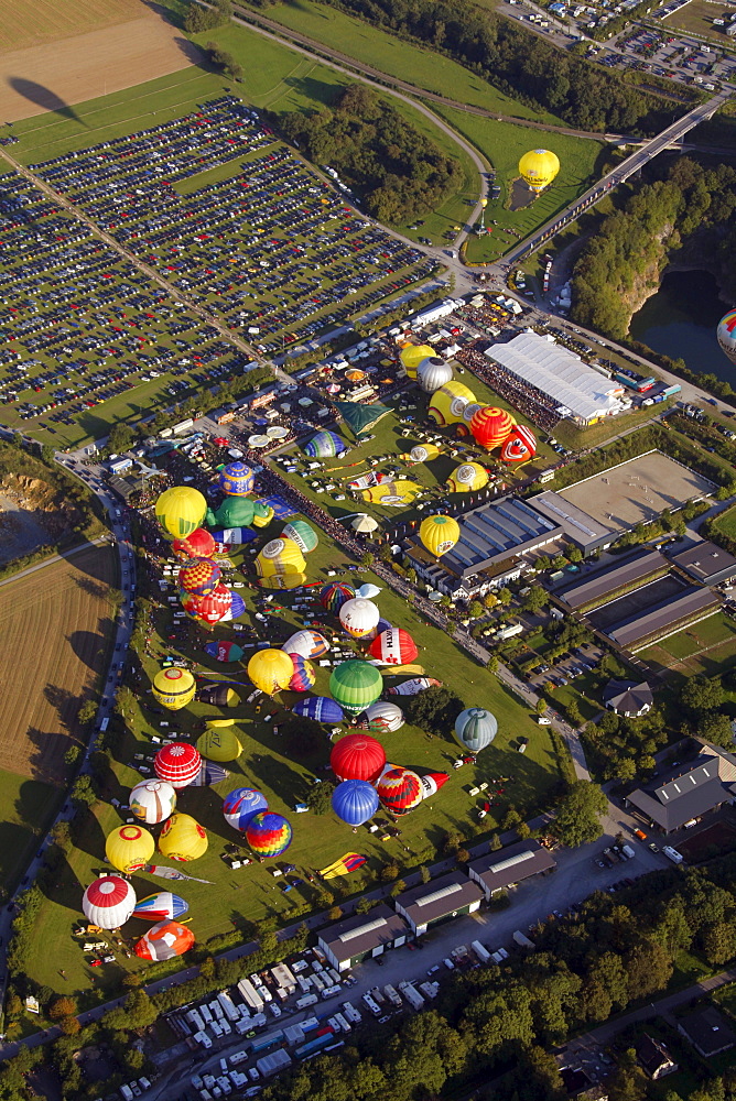 Aerial view, 20th Warsteiner Montgolfiade, hot air balloon festival with nearly 200 hot air balloons ascending into the sky, Warstein, Sauerland, North Rhine-Westphalia, Germany, Europe