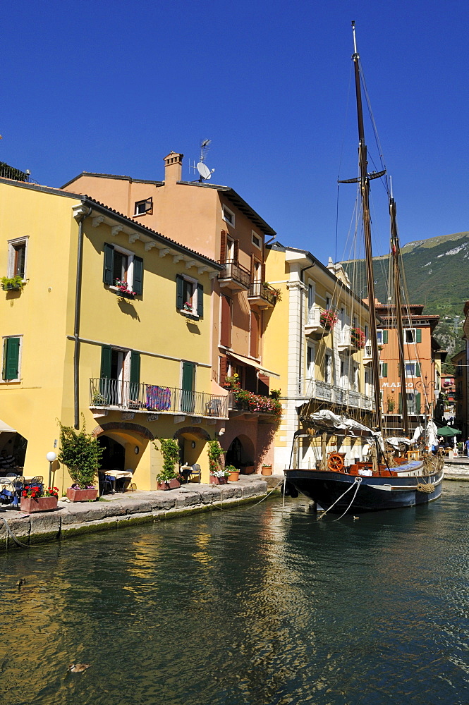 Historic sailboat in the harbour of Malcesine, Lake Garda, Veneto, Venetia, Italy, Europe