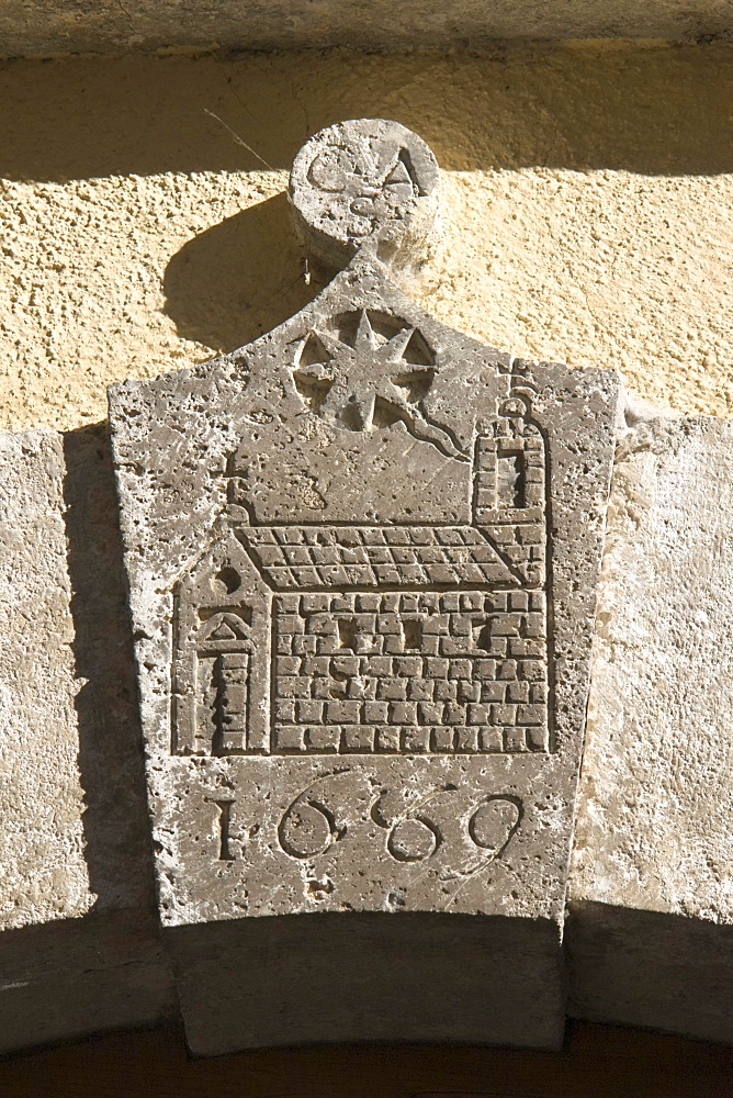 Ancient arch keystone decorated with the sketch of a church, a comet, the trigram CSA or CAS and the year 1669, Cittaducale, province of Rieti, Latium, Italy, Europe