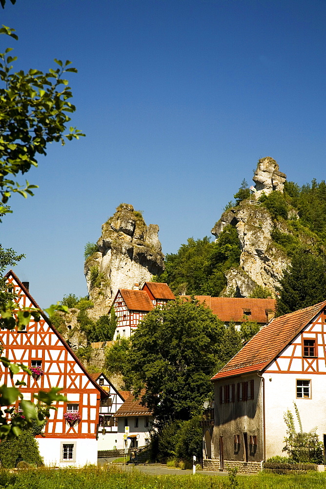 Historic timber mill and a historic half-timbered house built next to Jurassic rocks, Tuechersfeld, Little Switzerland, Upper Franconia, Bavaria, Germany, Europe