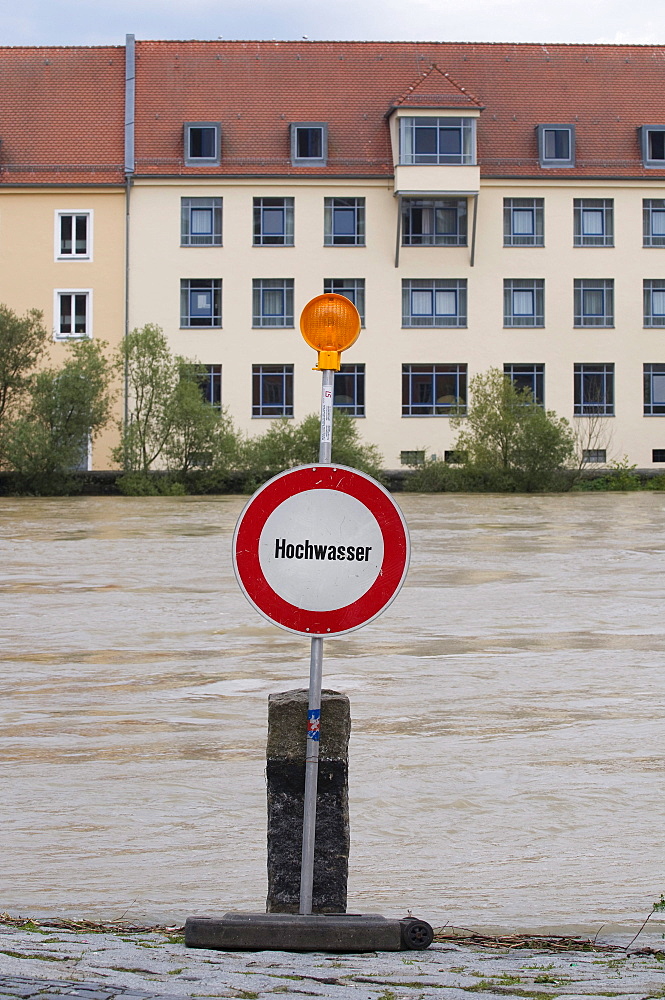 Sign with lamp in front of the river, floods on the Danube, Regensburg, Upper Palatinate, Bavaria, Germany, Europe