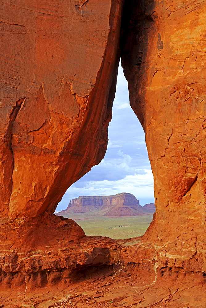 Looking through Tear Drop Arch towards the Mesas in Monument Valley, Arizona, USA, North America