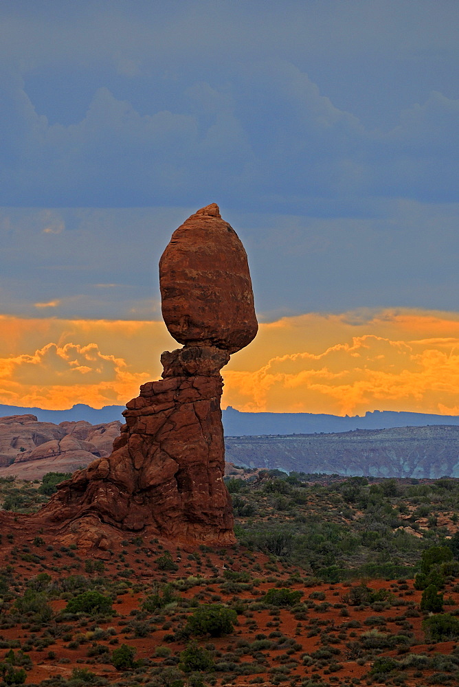 Balanced Rock at sunset with an oncoming thunderstorm, Arches National Park, Utah, Southwest, USA