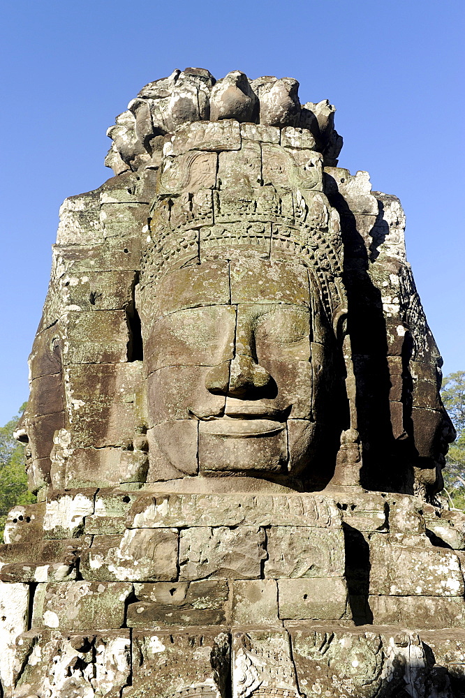 Carved stone face of Bodhisattva Lokeshvara over the south gate of Angkor Thom, Angkor, UNESCO World Heritage Site, Siem Reap, Cambodia, Southeast Asia, Asia