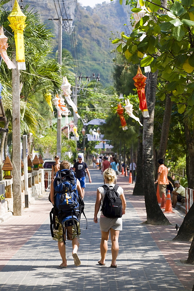 Backpackers walking along the boulevard of Ao Nang, Krabi Province, Thailand, Asia