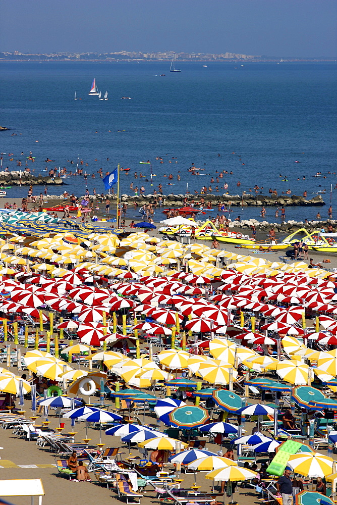 Parasols and sun loungers, mass tourism on the beach of Caorle, Adriatic Sea, Italy, Europe