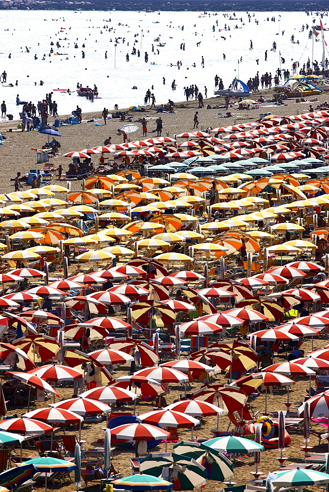 Parasols and sun loungers, mass tourism on the beach of Caorle, Adriatic Sea, Italy, Europe