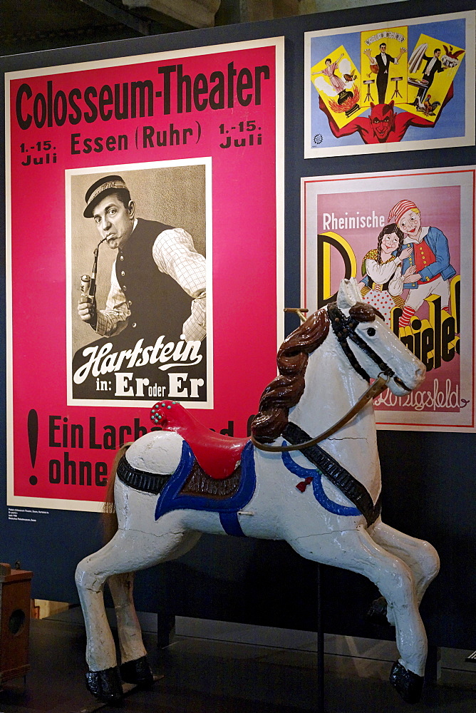 Historic poster of the Colosseum Theater Essen and a carousel horse, New Ruhr Museum, Zollverein Coal Mine Industrial Complex, Essen, North Rhine-Westphalia, Germany, Europe