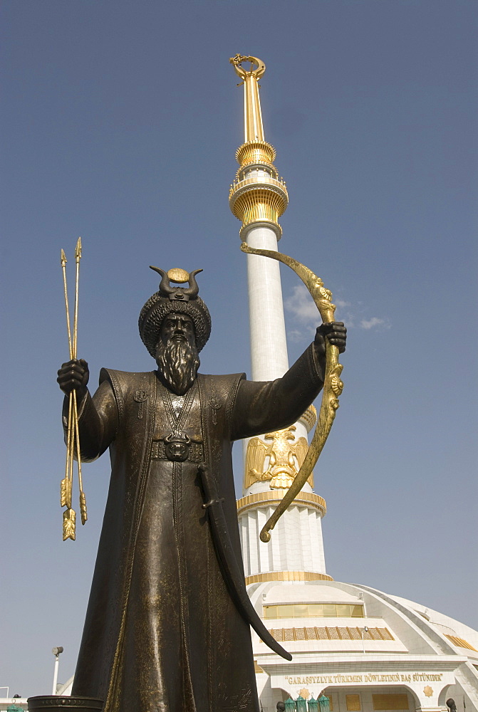 Statue with a sword in front of the Monument to the Independence of Turkmenistan, Ashgabat, Turkmenistan, Central Asia