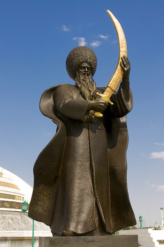 Statue with a sword in front of the Monument to the Independence of Turkmenistan, Ashgabat, Turkmenistan, Central Asia