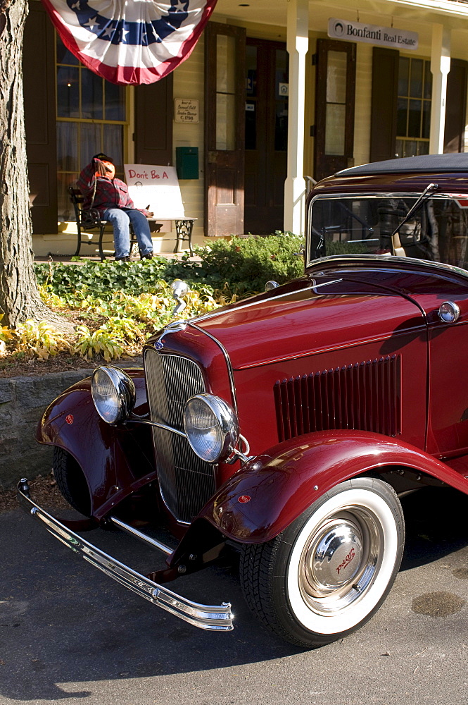 Vintage car parked in front of a typical American home, Connecticut, USA