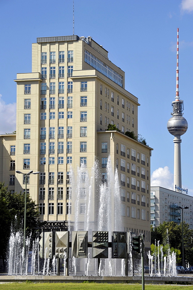 Fountain and high-rise building on Strausberger Platz square, TV tower, Berlin, Germany, Europe