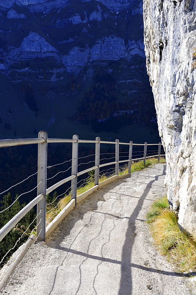 Safe trail path along the cliff of the Ebenalp between the Wildkirchli caves and Aescher mountain restaurant, Canton Appenzell-Innerrhoden, Switzerland, Europe