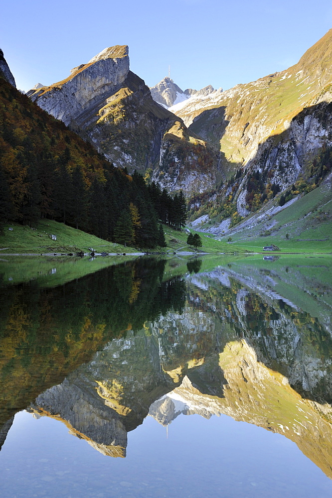 Early morning mood after sunrise looking over Seealp Lake, at 1143 m altitude, towards Rossmad Mountain, 2103 meters high, right behind, Saentis Mountain, Canton of Appenzell Inner-Rhodes, Switzerland, Europe