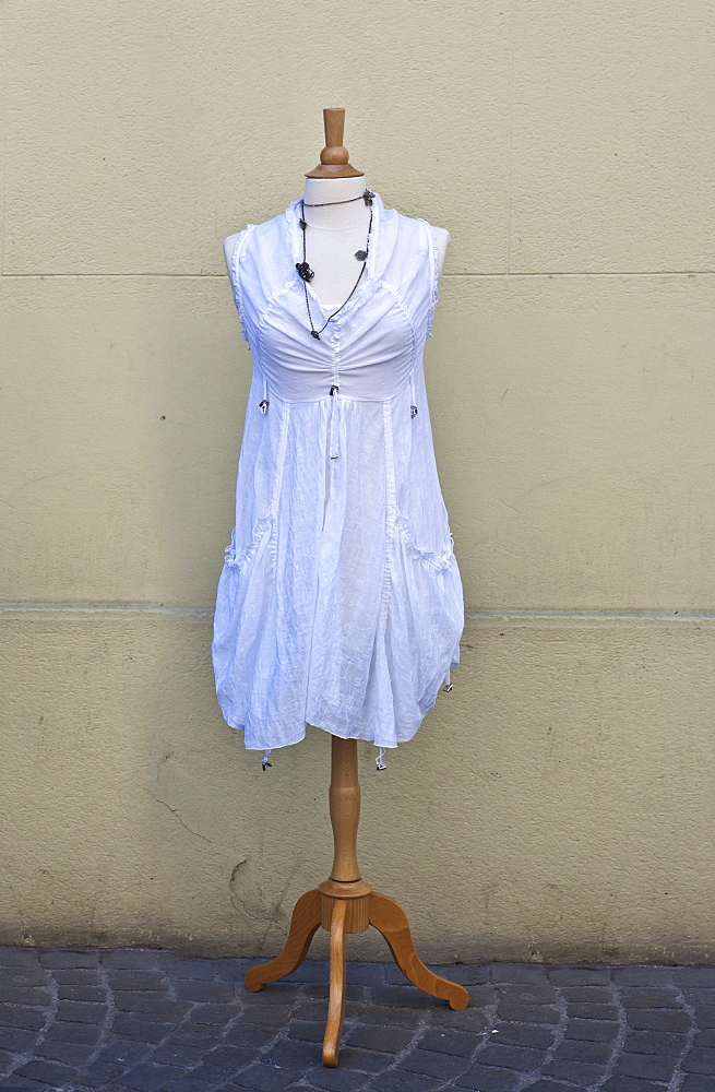 Dressmaker's dummy with a white dress