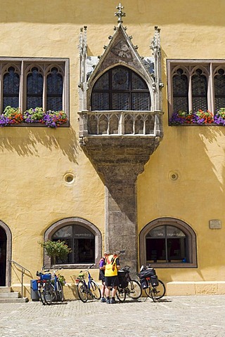 Cyclists in front of the Reichssaalbau building, Regensburg, Upper Palatinate, Bavaria, Germany, Europe