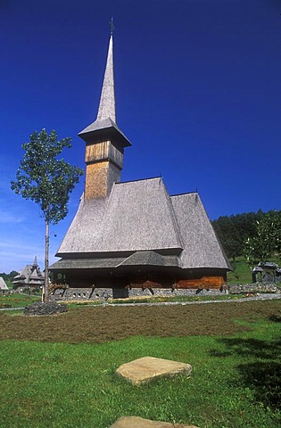 Orthodox wooden church, tower and nave are covered with wood shingles, Vatra Dornei, Maramures, Romania, Europe